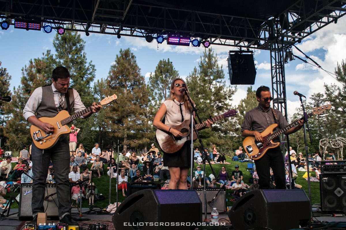 Band performing live on outdoor stage.