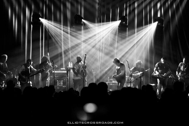 Black and white band performing on stage.