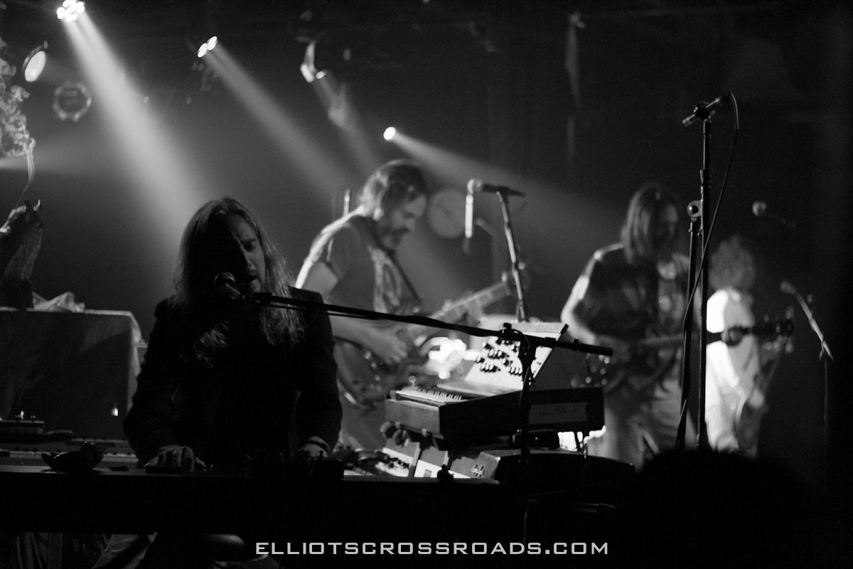 Band performing on stage with instruments.