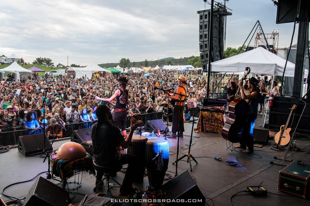 Band performing at outdoor music festival.