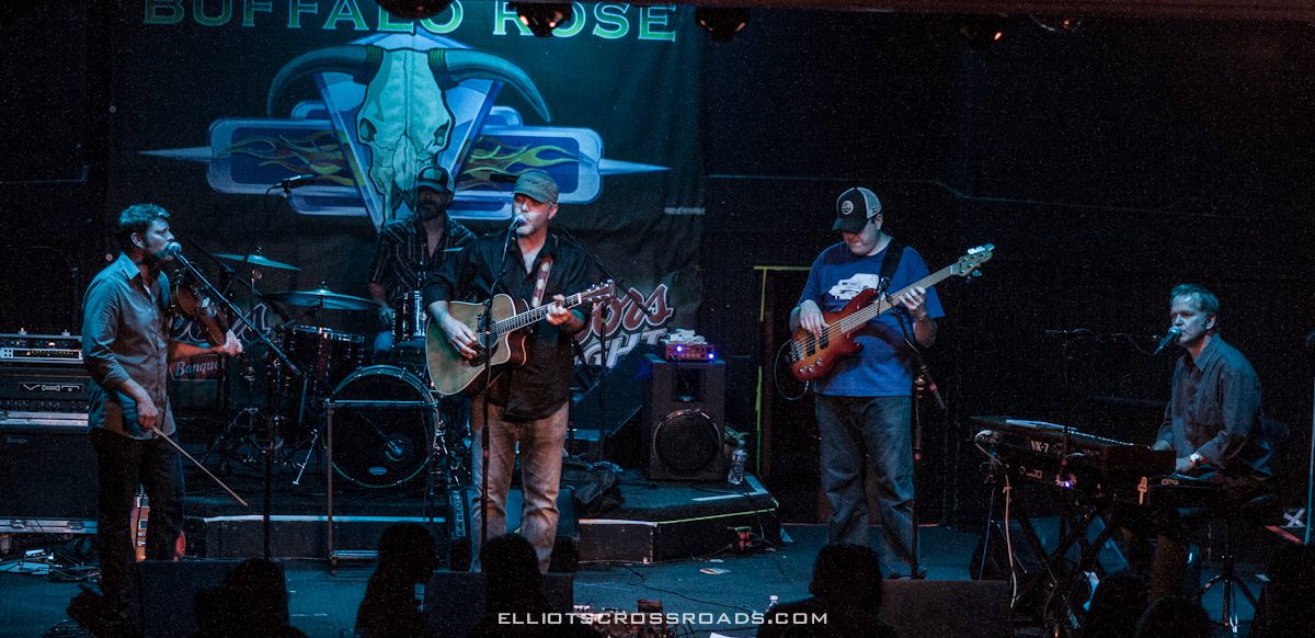 Band performing on stage at Buffalo Rose.