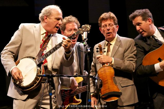 Bluegrass band performing with banjo and fiddle.