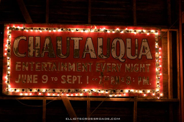 Sign with lights advertising nightly entertainment.