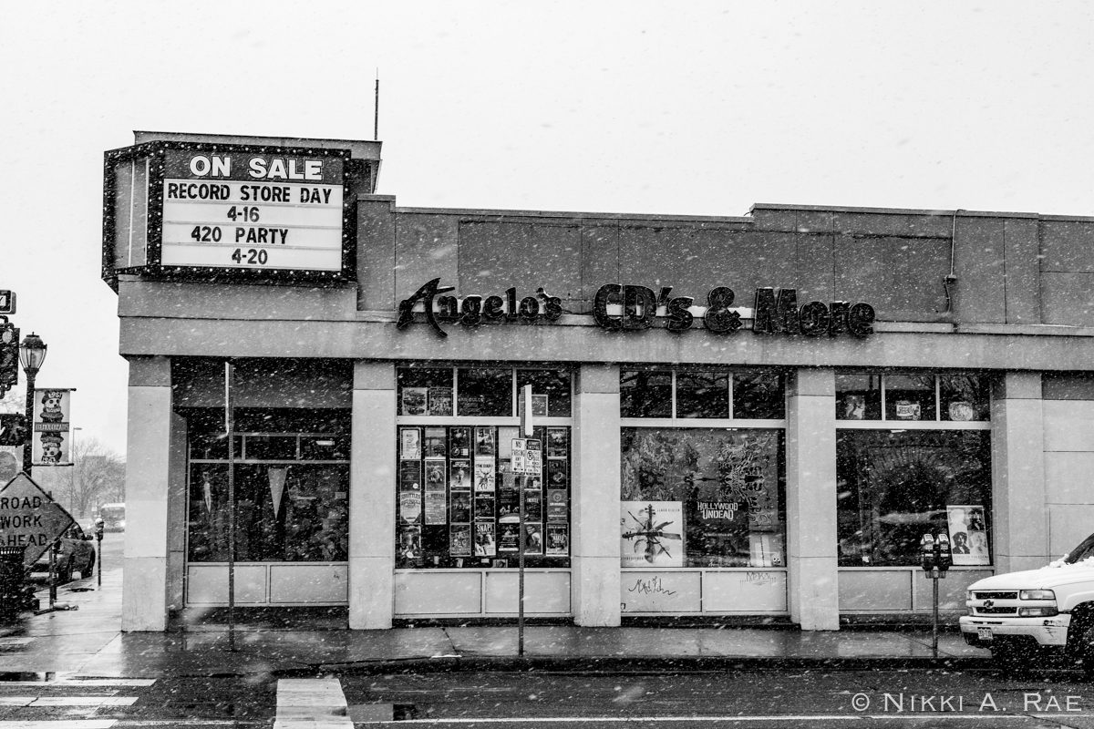 Record store building with event sign.
