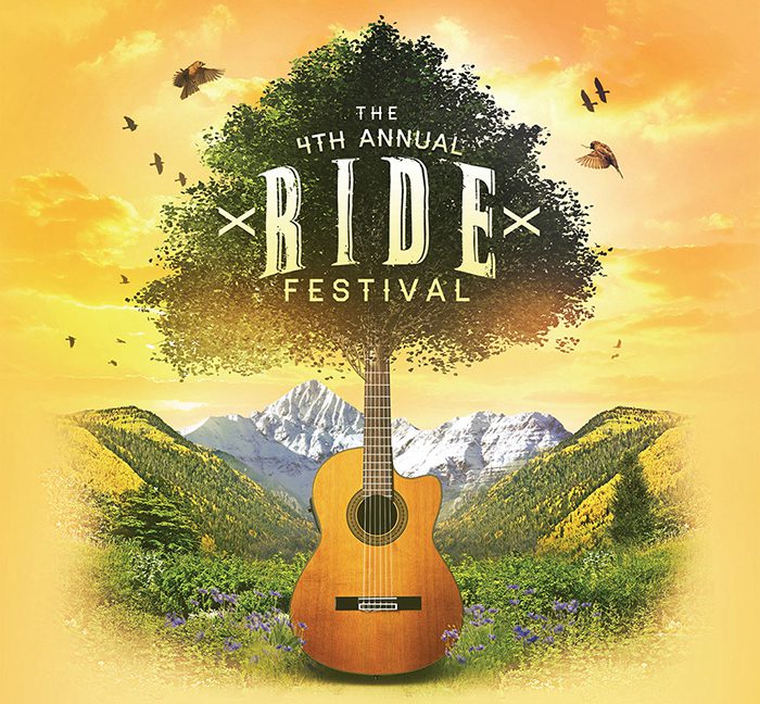 Guitar and tree with mountain background.