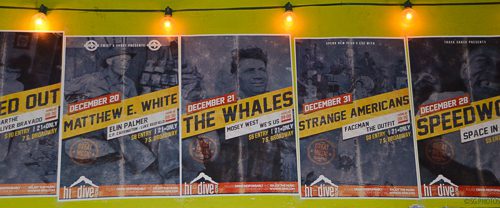 Concert posters with event dates and performers.
