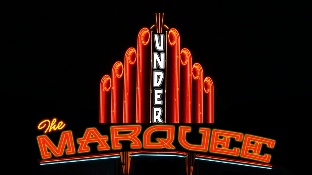 Neon sign reading "Under the Marquee.
