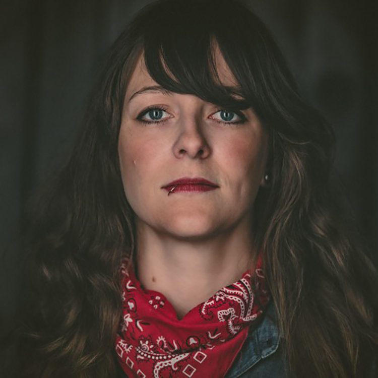 Woman with red bandana and dark hair.