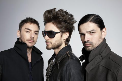 Three men in stylish black clothing.