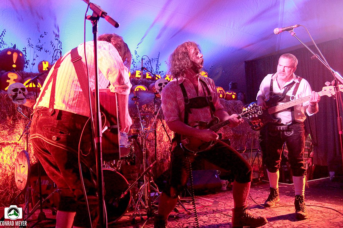 Band performing in Halloween-themed setting.