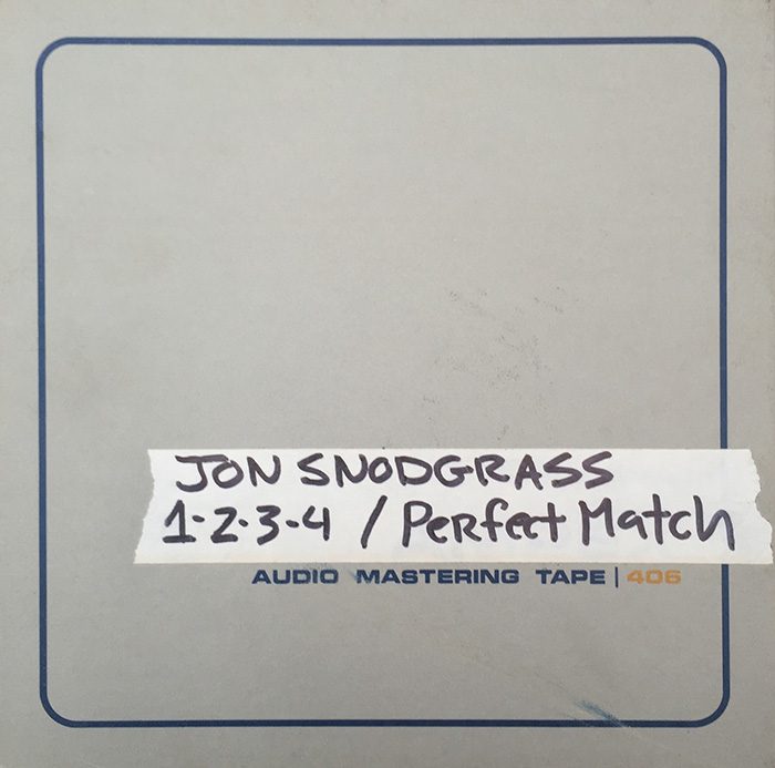 Audio mastering tape labeled "Jon Snodgrass" songs.