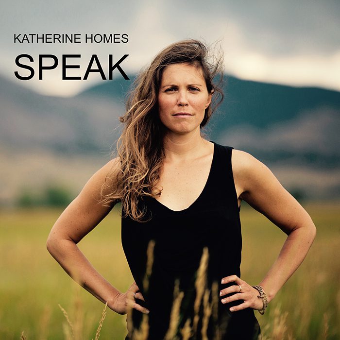 Woman standing in a field, album cover.