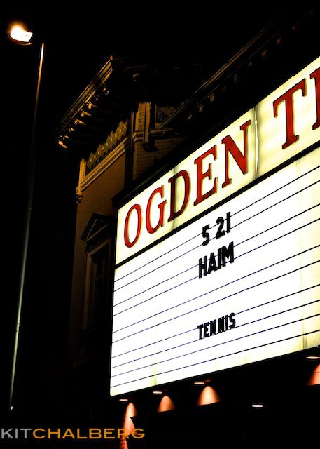 Theater marquee with concert dates displayed.