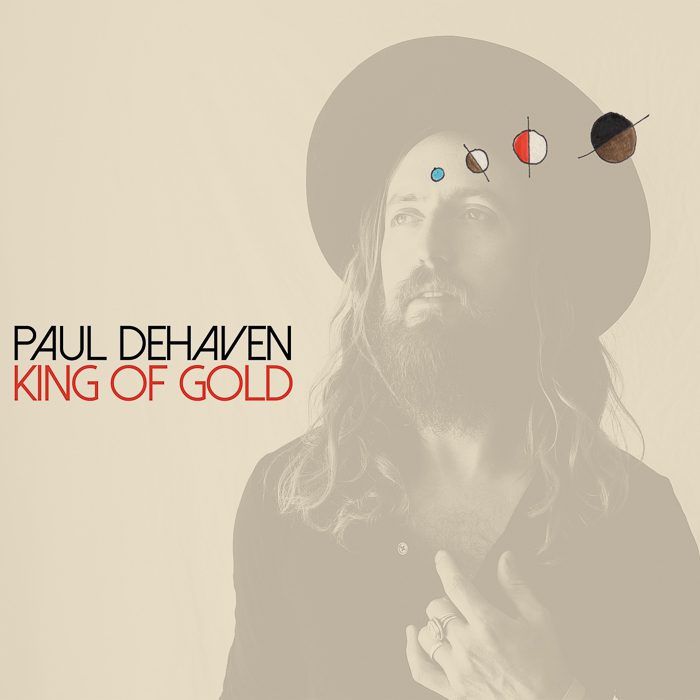 Man with hat, cosmic symbols, album cover.