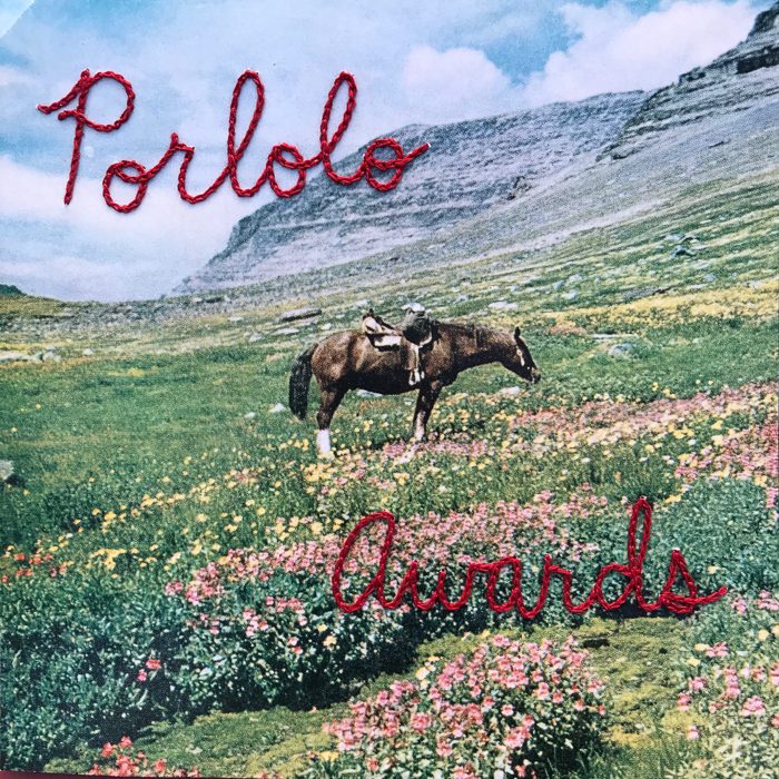 Horse in colorful flower meadow, "Porlolo Awards".