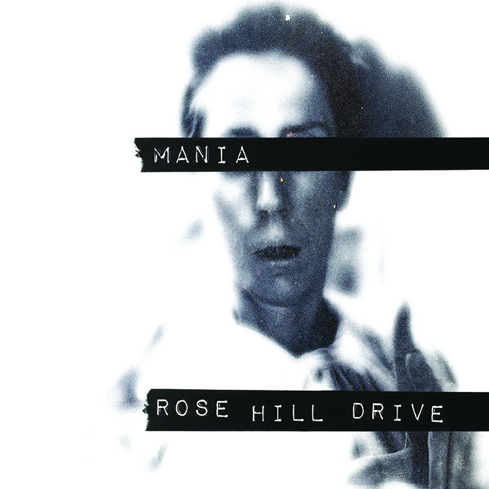 Blurred face with text "Mania" and "Rose Hill Drive".