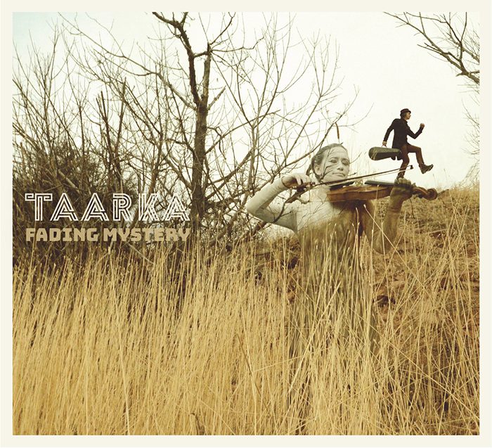 Violinist in field with running figure.