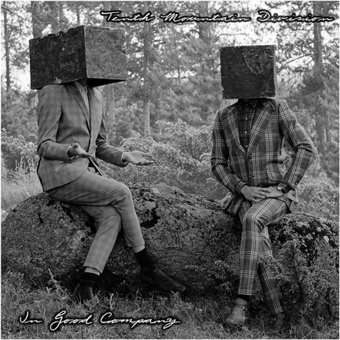 Two people with cube heads sitting outside.