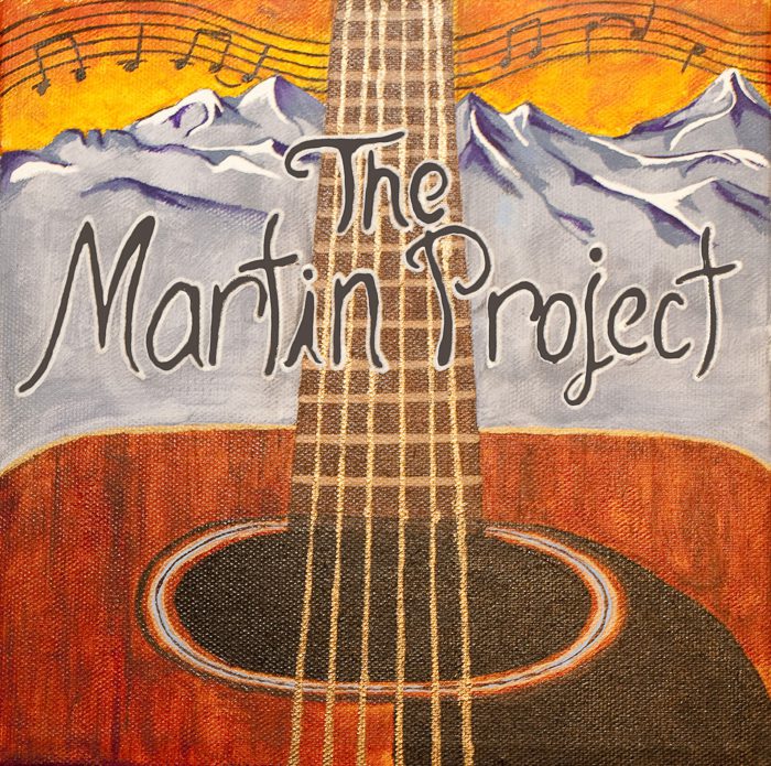 Guitar with mountains and musical notes background.
