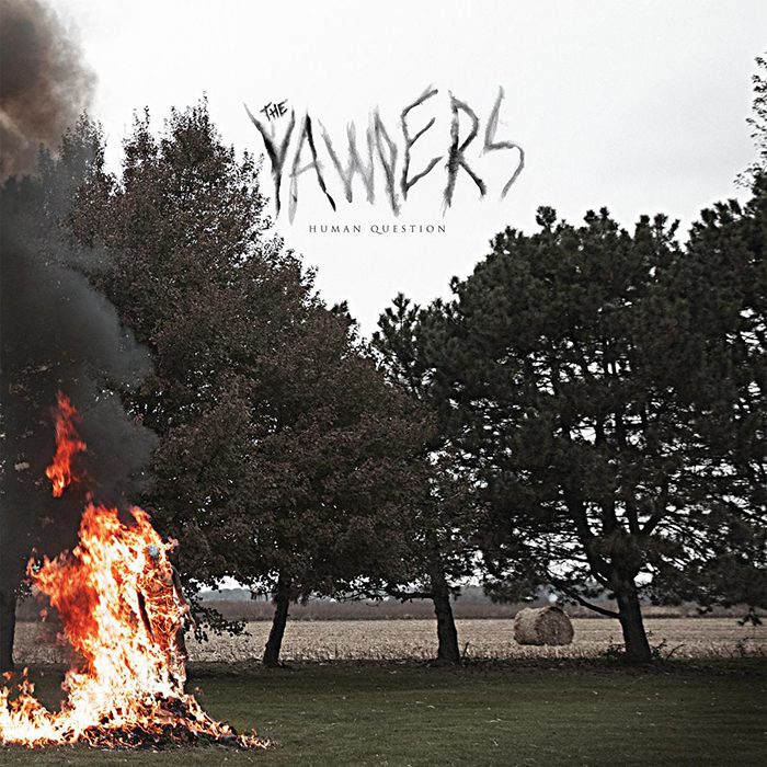 Fire burning in a rural landscape setting.