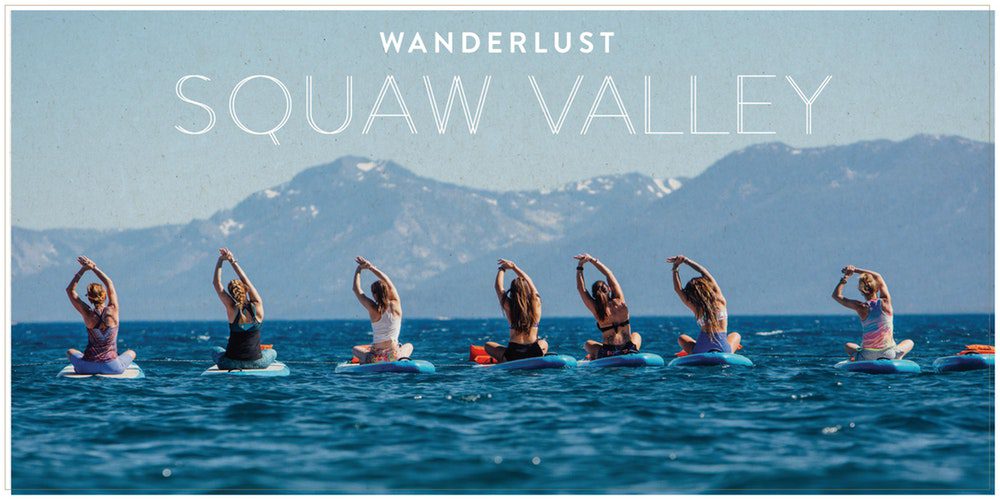 People practicing yoga on paddleboards.
