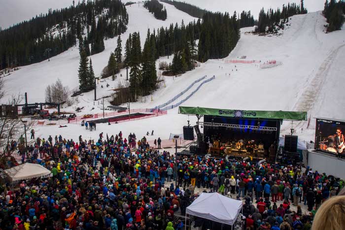 Outdoor concert at snowy mountain ski resort.
