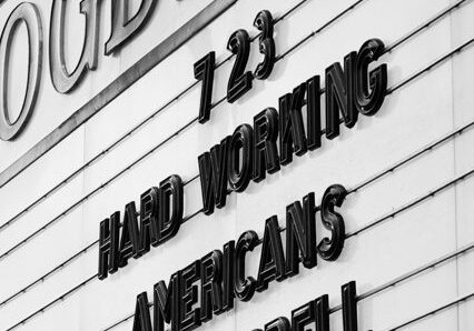 Theater marquee with concert information displayed.