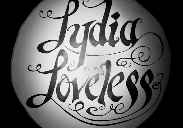 Decorative 'Lydia Loveless' black script logo.