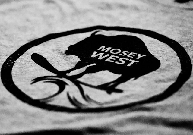 Gray shirt with black "Mosey West" logo.