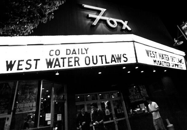 Theater marquee displaying West Water Outlaws.