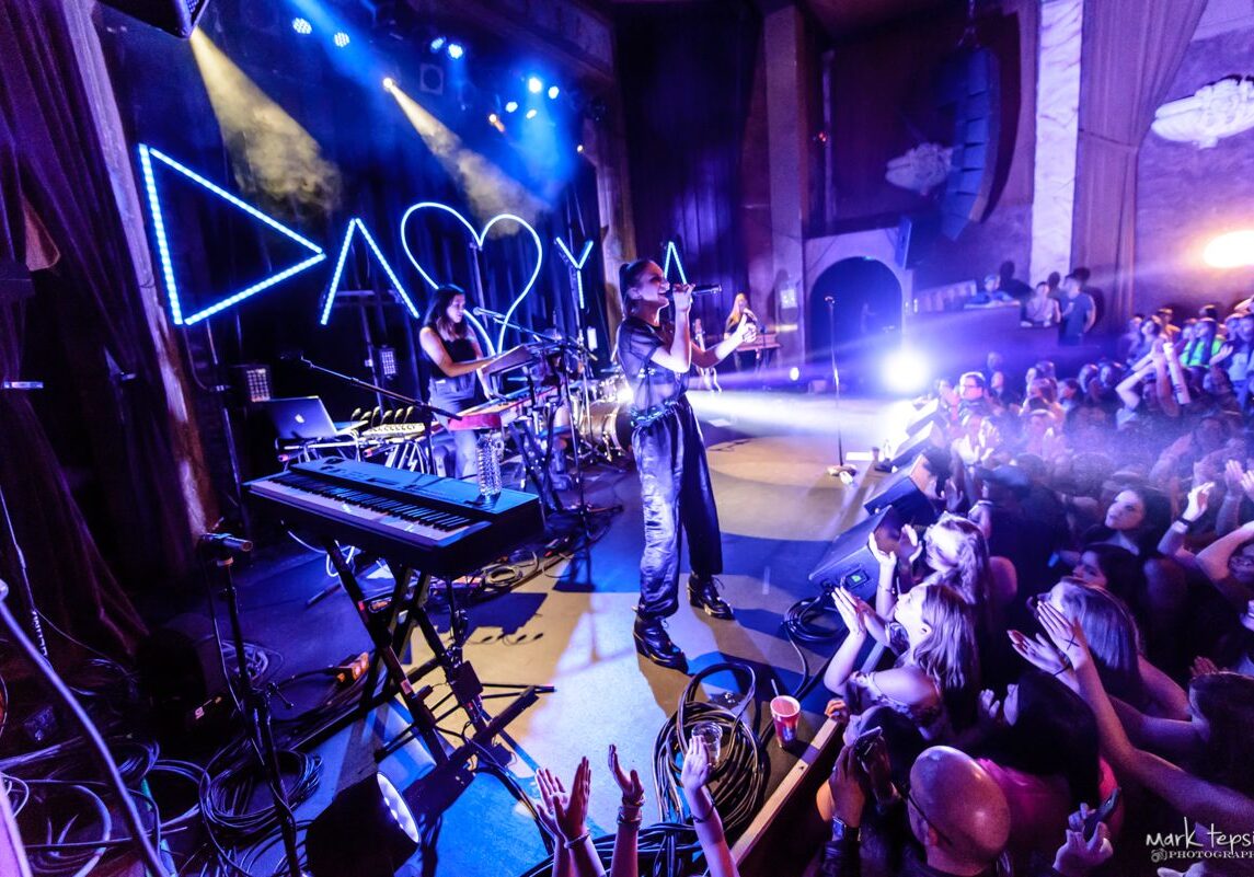 Live concert with vibrant stage lighting.