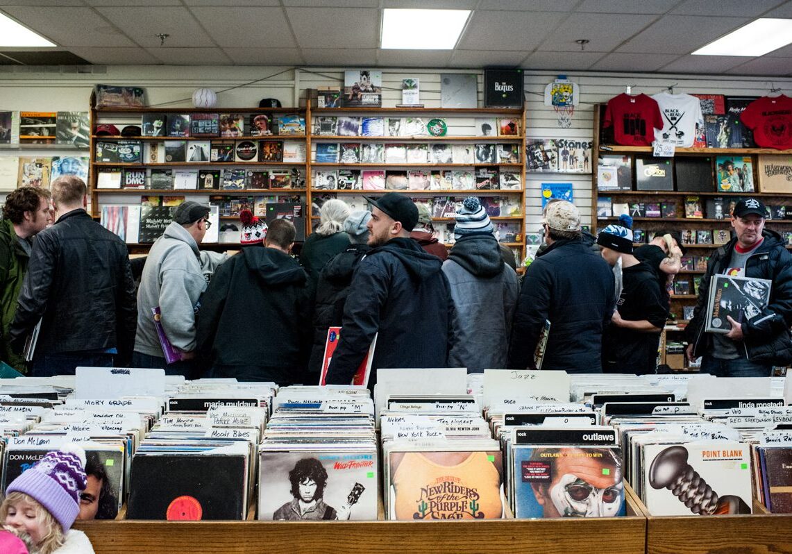 People browsing records in a music store.