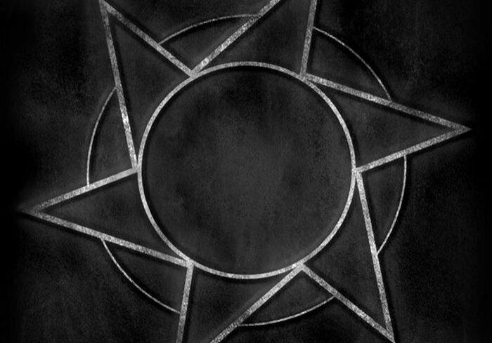 Abstract star design on dark background.