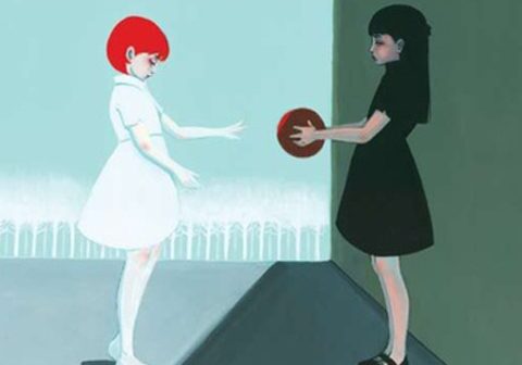 Two girls with ball, contrasting colors.
