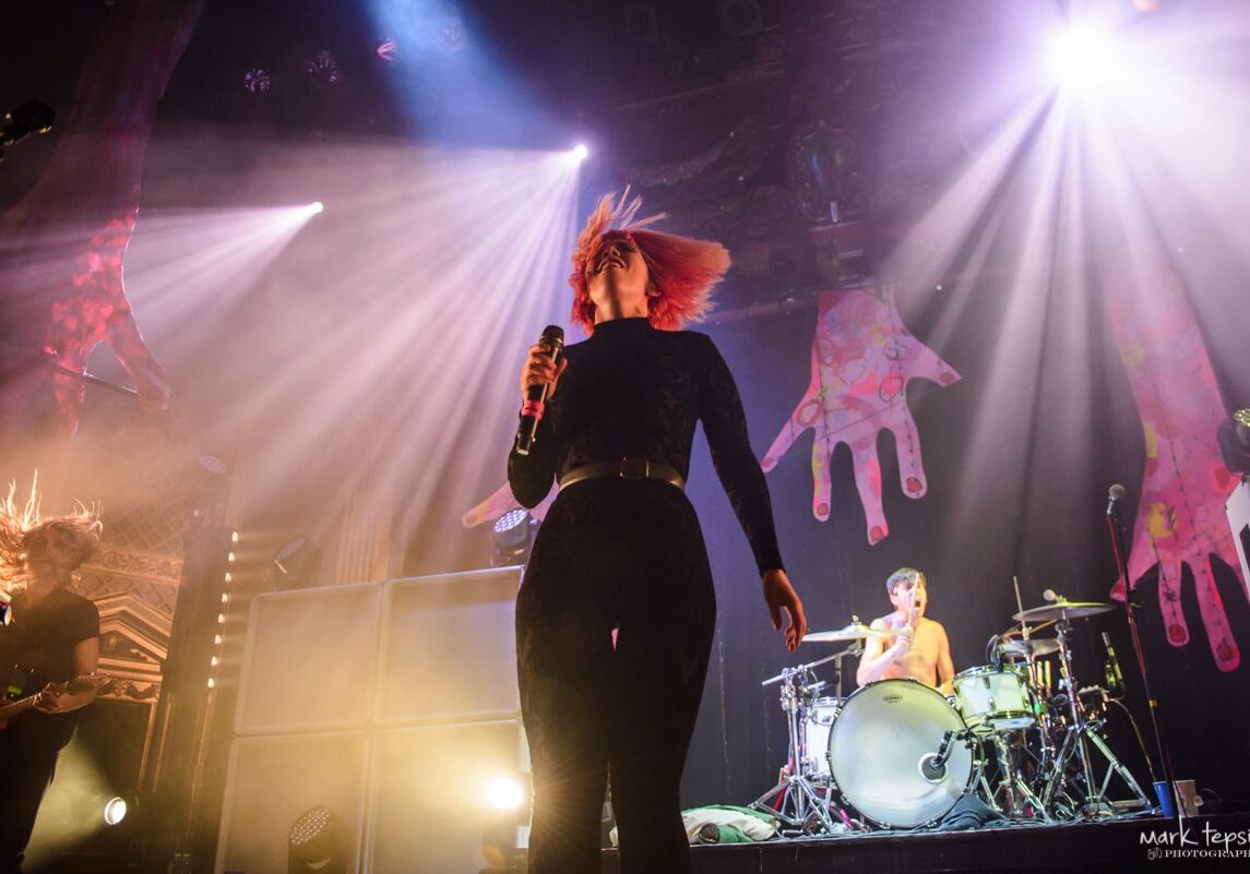 Live band performance with dynamic stage lighting.