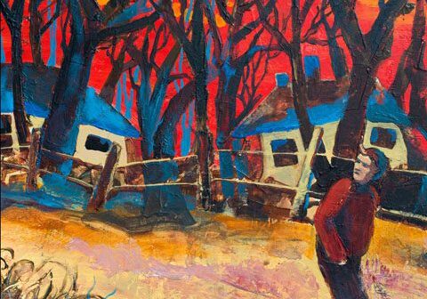 Man walking near trees and colorful sunset.