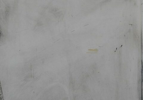 Gray textured surface with small American flag.
