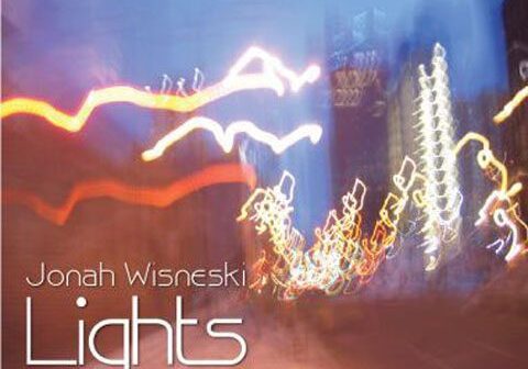 Blurry city lights with text overlay.