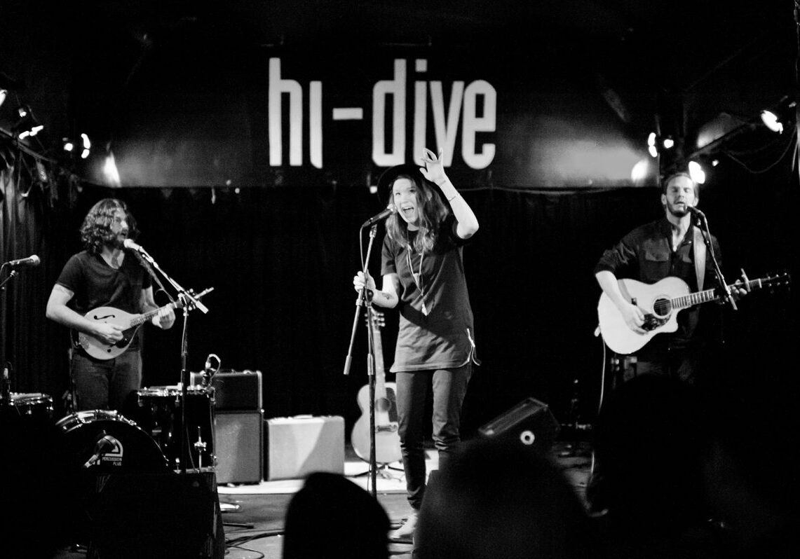 Band performing live at hi-dive venue.