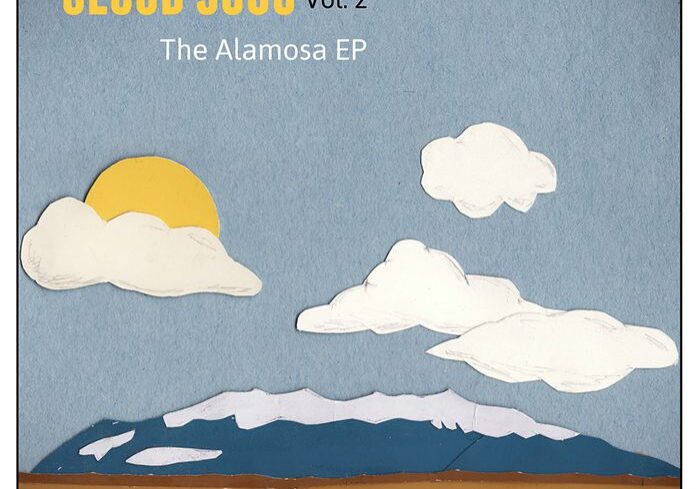 Clouds and mountains with a yellow sun.