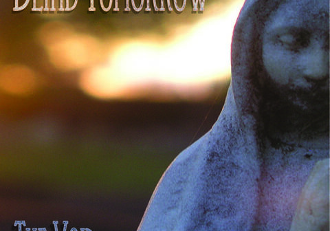 Stone statue with sunset background, text overlay.