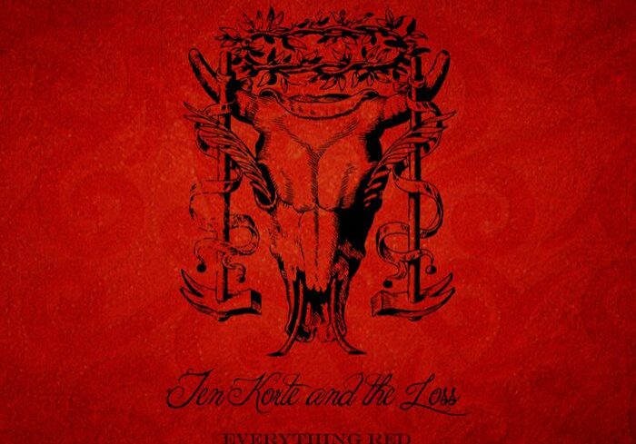 Red album cover with intricate black design.