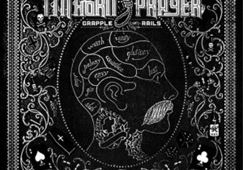 Decorative album cover with intricate black design.