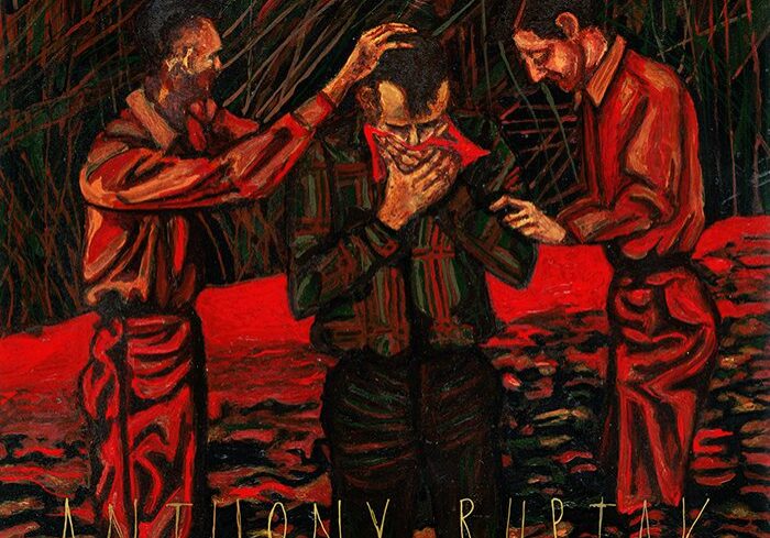 Three figures in a red-toned scene.