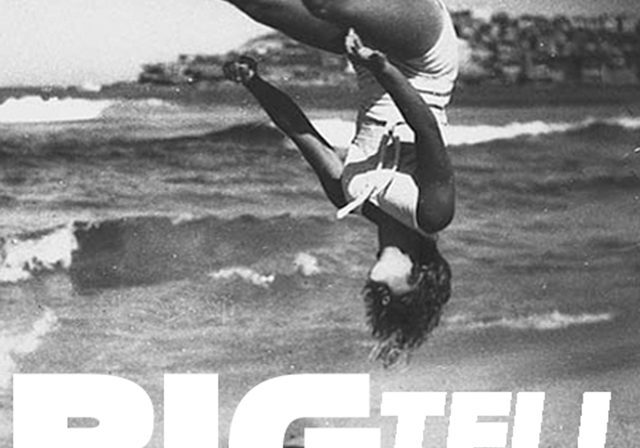Person flipping on a beach, "BIG TELL".