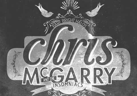 Vintage-style band logo with decorative elements.