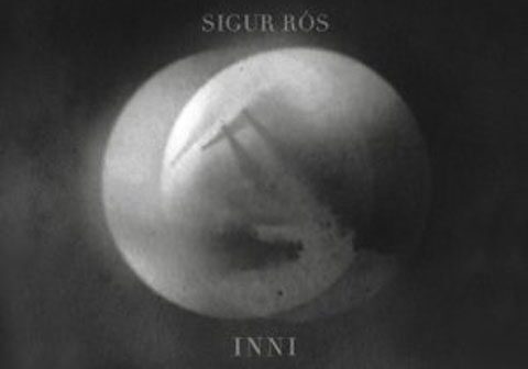 Abstract album cover with circular design.