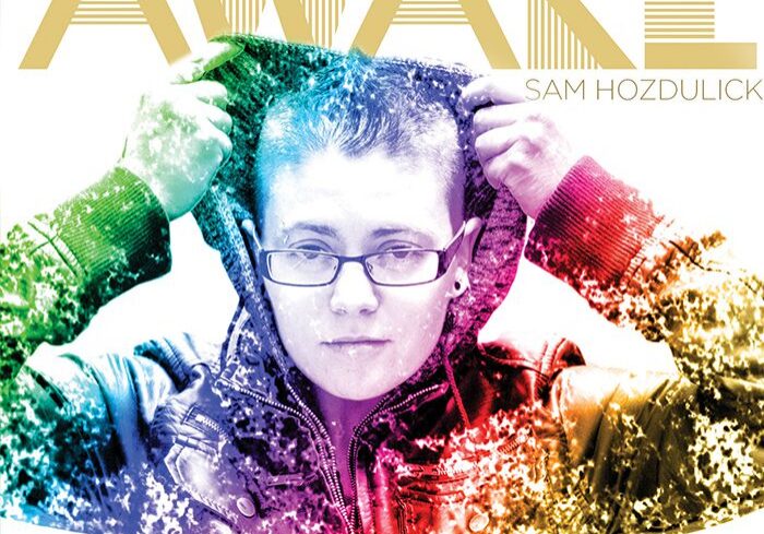 Colorful album cover with person in jacket.