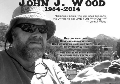 Man outdoors with memorial text overlay.