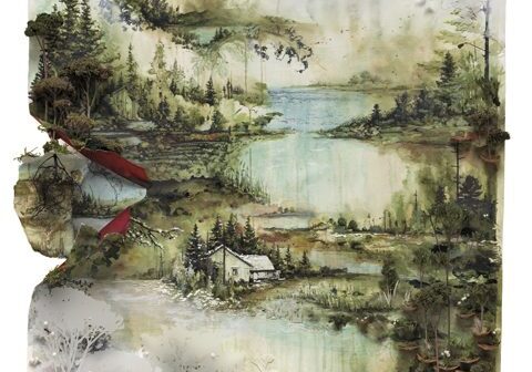 Scenic landscape with lakes and forested hills.